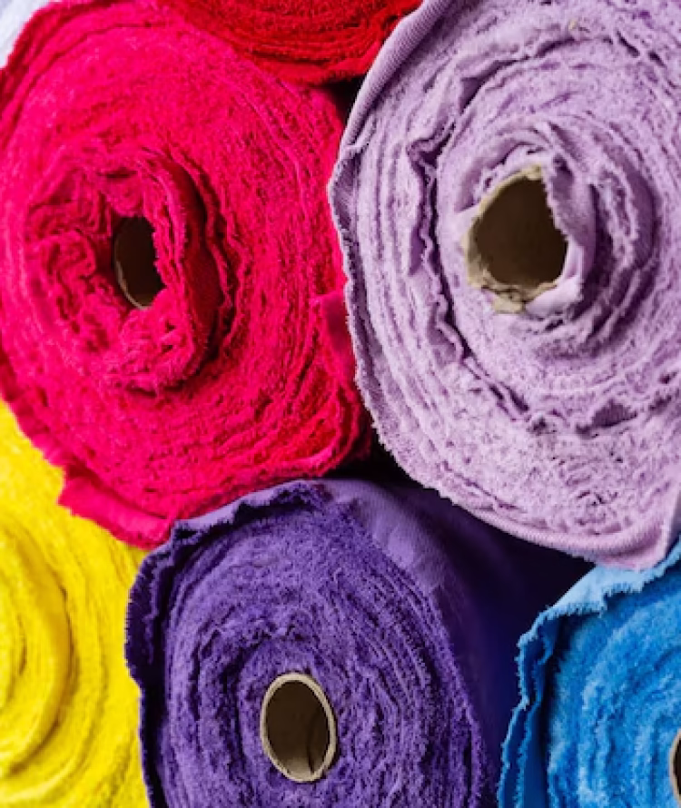 multicolored-rolls-with-knitted-fabric-close-up_432395-92